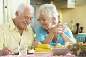dental implant patients sitting at dinner table