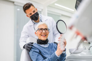 dental patient looking at new dental implants