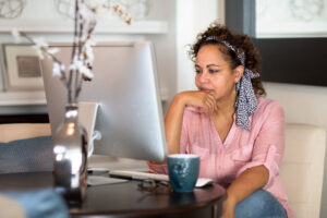 dental patient thinking looking at laptop