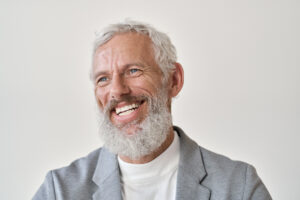 senior man with nice smile implant dentistry concept